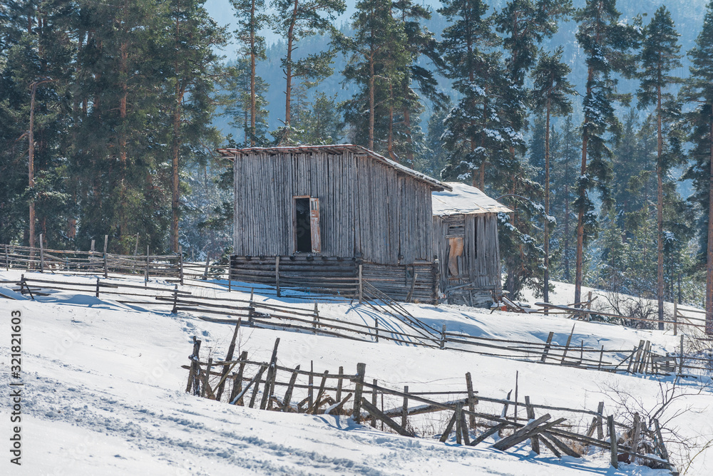 Old wooden Barn in Field, Winter mountain snow landscape
