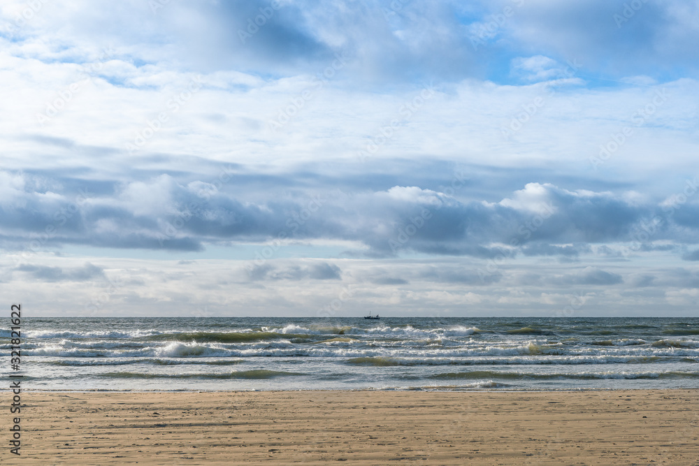 Beautiful winter Baltic sea on a windy day. In a distant fishing boat. Beautiful winter Baltic sea on a windy day. In a distant fishing boat.