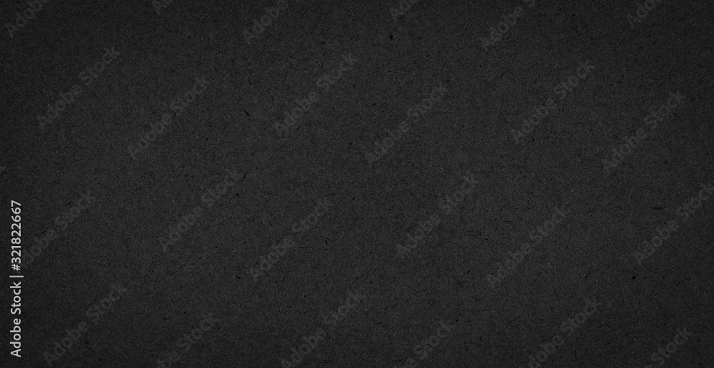 Texture of black gift rough paper with fibers. Dark background for design, template, greeting card, website backdrop.