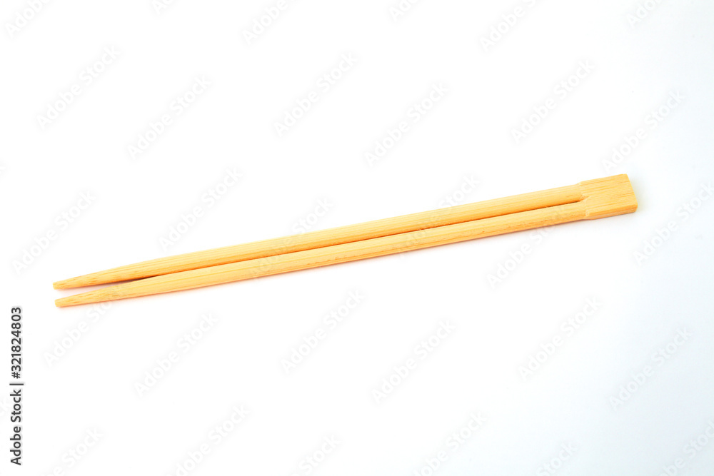 disposable chinese chopsticks on white background close-up