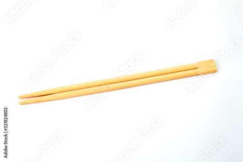 disposable chinese chopsticks on white background close-up