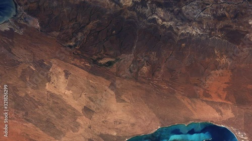 Aerial satellite Australian Ningaloo marine park, coastline and coral reef ecosystem on Indian ocean, sunrise animation. Images furnished by Nasa photo