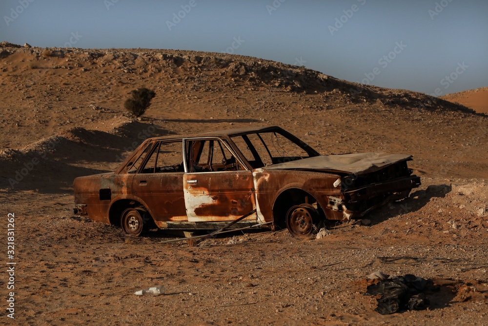 abundan car left to rust in desert