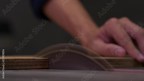 Table Saw cutting Plywood in Shop photo