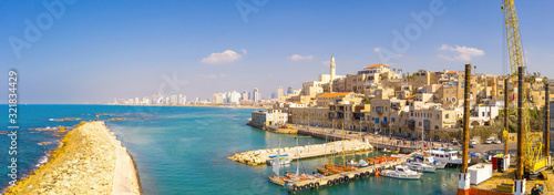 Panoramic view of The old city port of Jaffa with modern Tel Aviv skyline in the background.