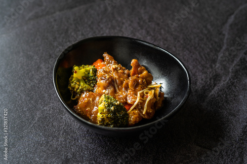 Shanghai Style Sea Bass Fish Fillets Food with Vegetables, Soy Sprouts and Broccoli. photo