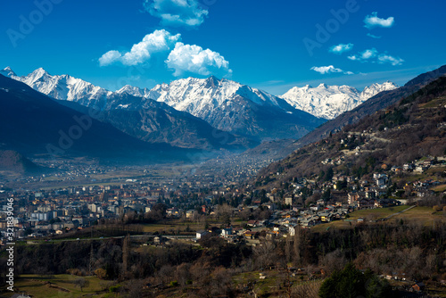 aerial view on aosta city with mountains in the background