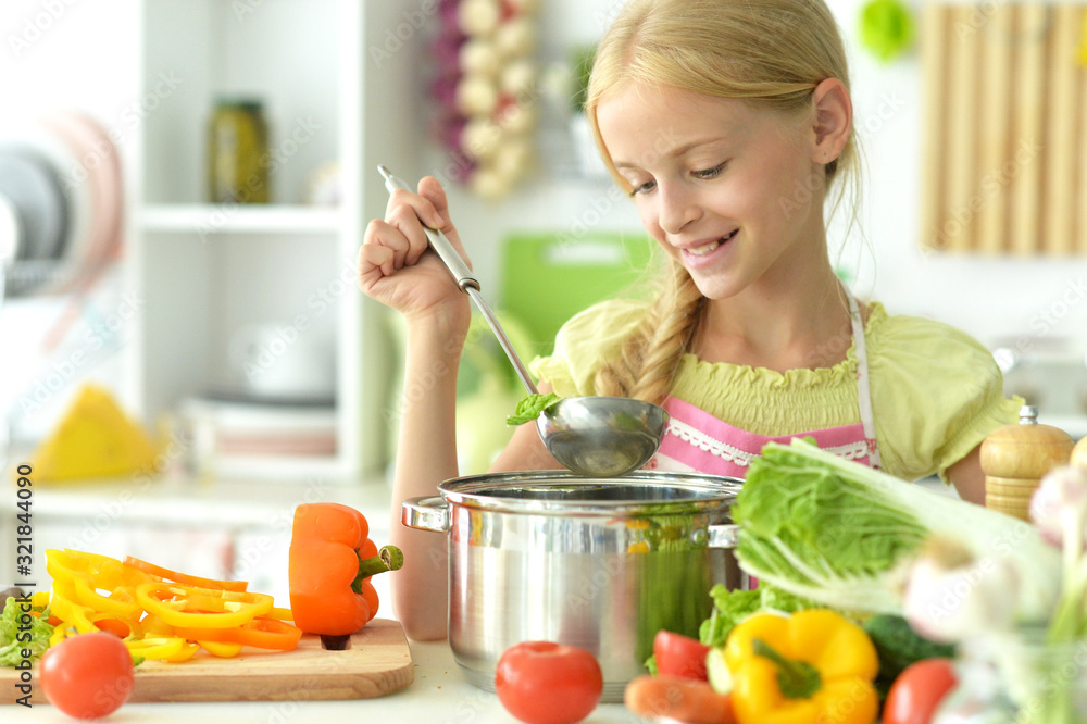 Portrait of cute girl cooking on kitchen soup Portrait of cute girl cooking on kitchen soup