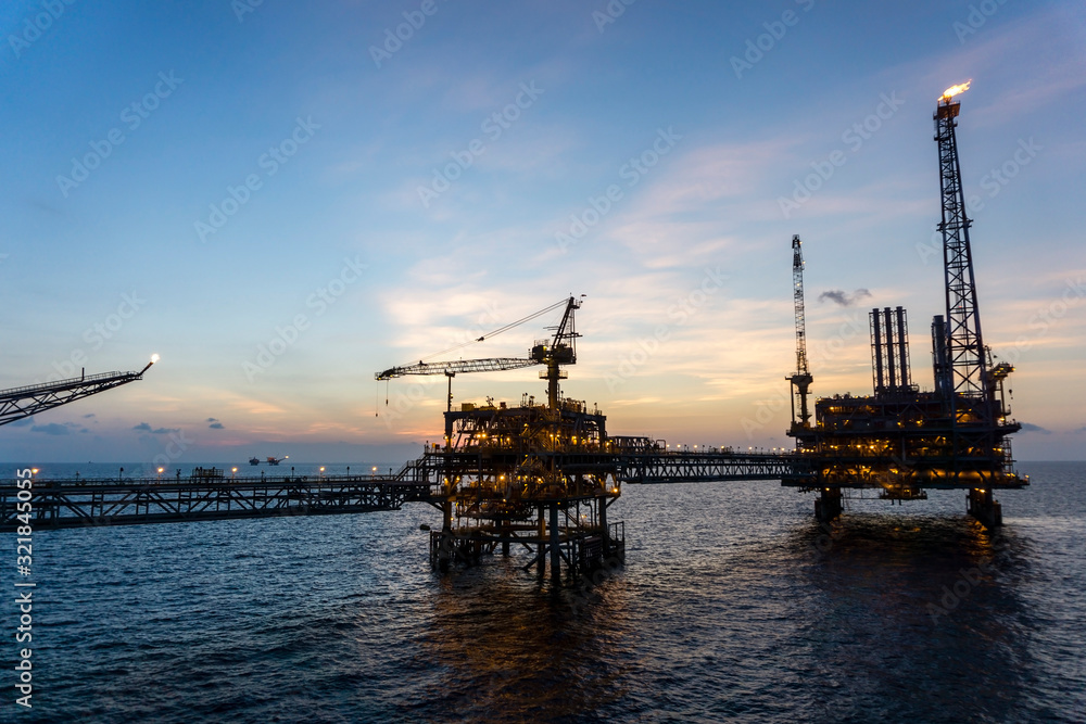 Offshore production platforms complex connected with bridges at oil field