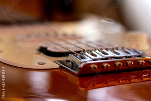 Canvas Print Brecht/Belgium - december 31 2018: A close up portrait of the bridge and the bridge pins of a guitar