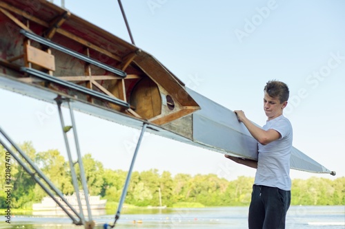 Active healthy lifestyle teens. Boys paddling sport kayak