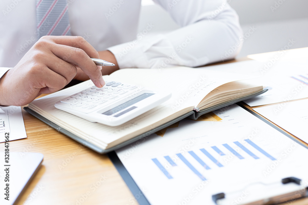 Businessmen use graphs to summarize results and calculate income-expenses to find financial balance points and use them to improve and advance business, finance and economic concepts. Businessmen use graphs to summarize results and calculate income-expenses to find financial balance points and use them to improve and advance business, finance and economic concepts.