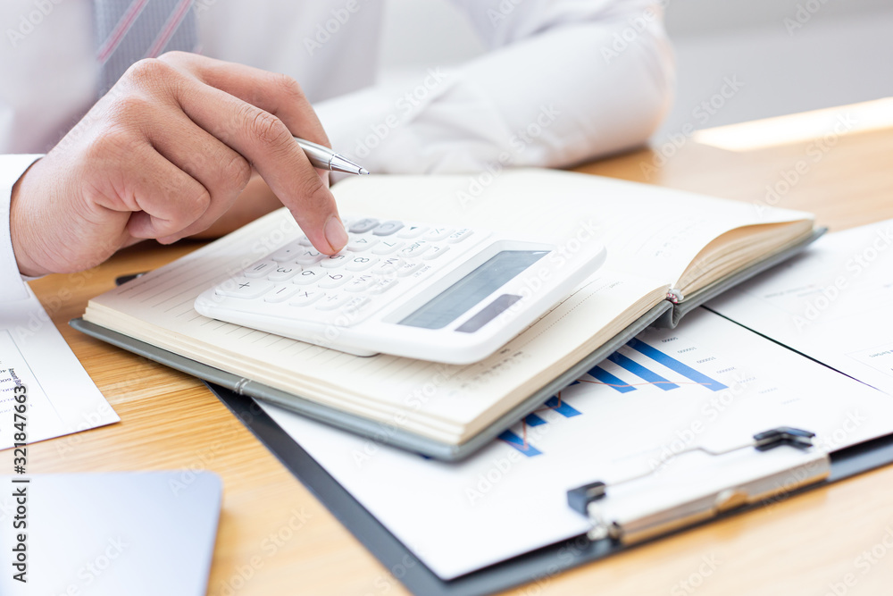 Businessmen use graphs to summarize results and calculate income-expenses to find financial balance points and use them to improve and advance business, finance and economic concepts. Businessmen use graphs to summarize results and calculate income-expenses to find financial balance points and use them to improve and advance business, finance and economic concepts.