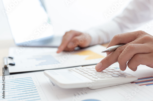  Businessmen use graphs to summarize results and calculate income-expenses to find financial balance points and use them to improve and advance business, finance and economic concepts.