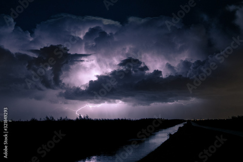 Lightning bolt from a huge thunderstorm hits the ground