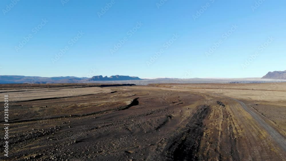 4K realtime aerial view of beautiful mountains scenery, wide open field and vehicle on the road at Sveitarfelagid Hornafjordur, Iceland with moving up focus. 4K realtime aerial view of beautiful mountains scenery, wide open field and vehicle on the road at Sveitarfelagid Hornafjordur, Iceland with moving up focus.