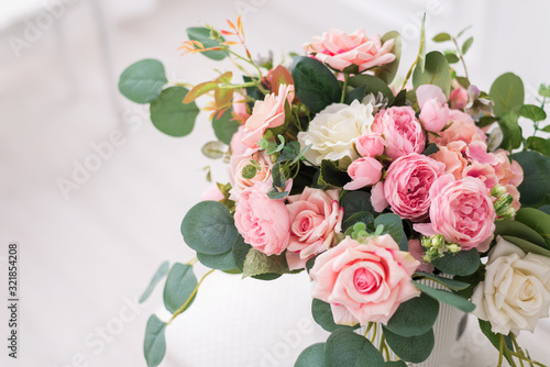 Bouquet composition with beautiful roses in a gift box. Wedding background, postcard with space for text