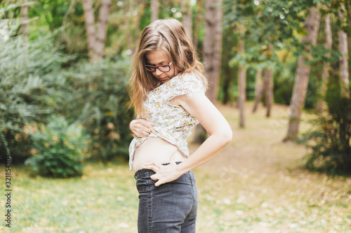 Woman inspecting her skin