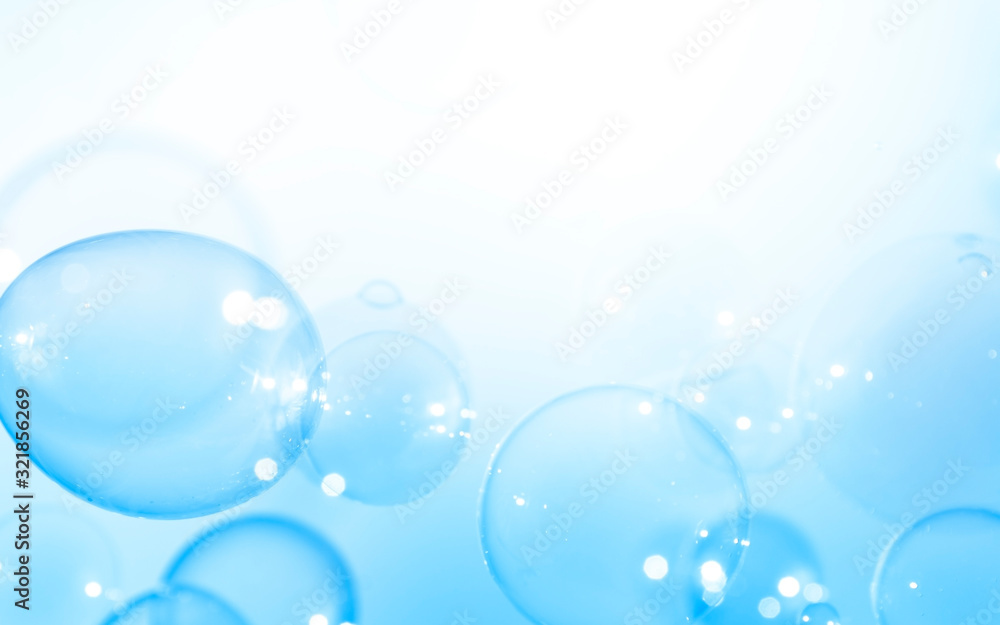 Blue bubbles float on a white background