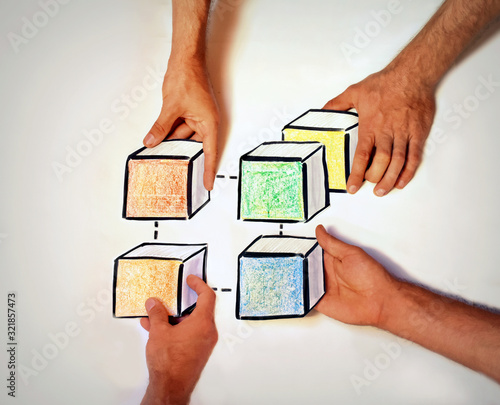 Foto concept picture addressing blockchain interoperability with four hands holding c