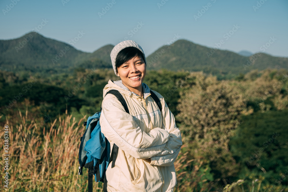 Asian young men 25-30 year are happy with mountain landscape nature hiking outdoor.