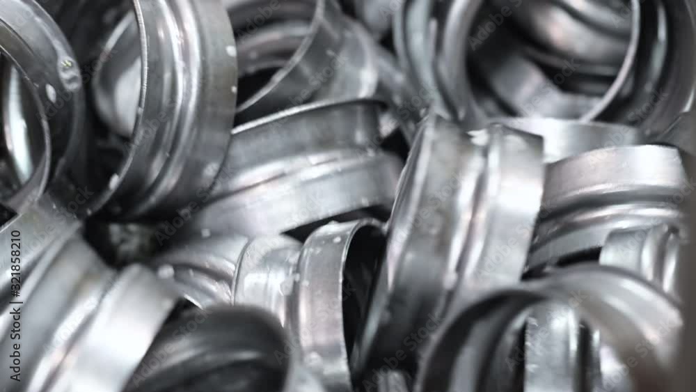Finished metal pieces in conveyor belt of metal stamping industry. Industrial background . Finished metal pieces in conveyor belt of metal stamping industry. Industrial background .