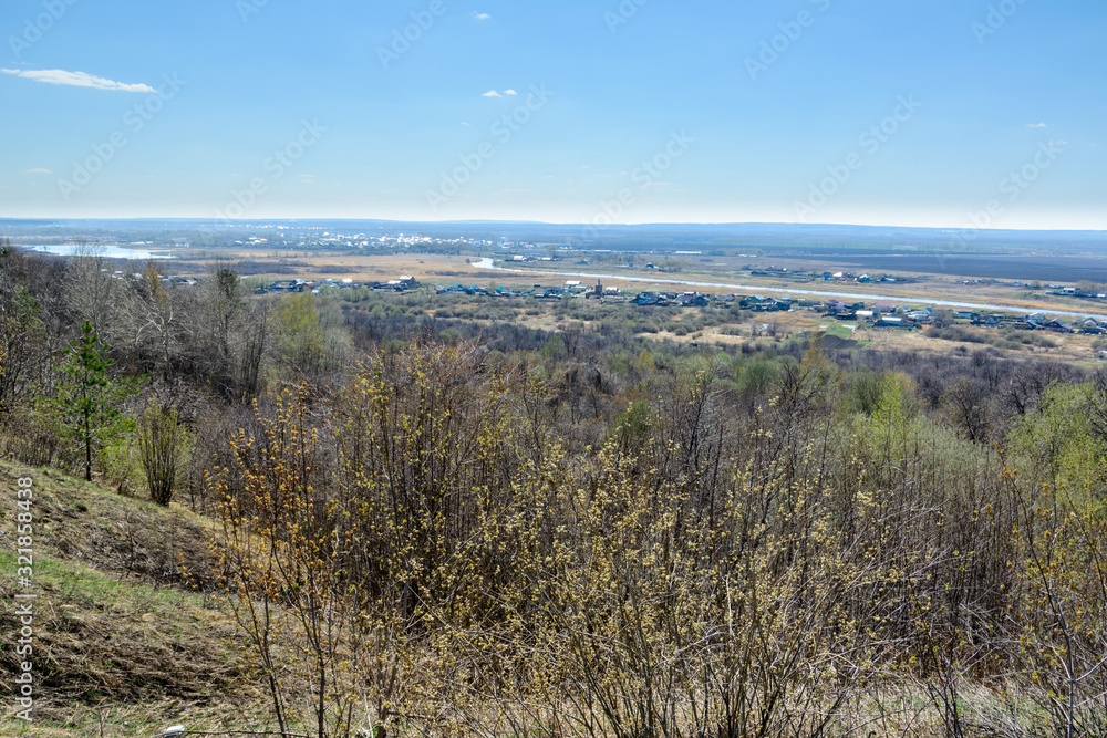 Beautiful view of the fields, meadows, the village and the river Sviyaga. Panorama of the famous Sviyaga river from a high mountain. Ulyanovsk region, Russia. Beautiful view of the fields, meadows, the village and the river Sviyaga. Panorama of the famous Sviyaga river from a high mountain. Ulyanovsk region, Russia.
