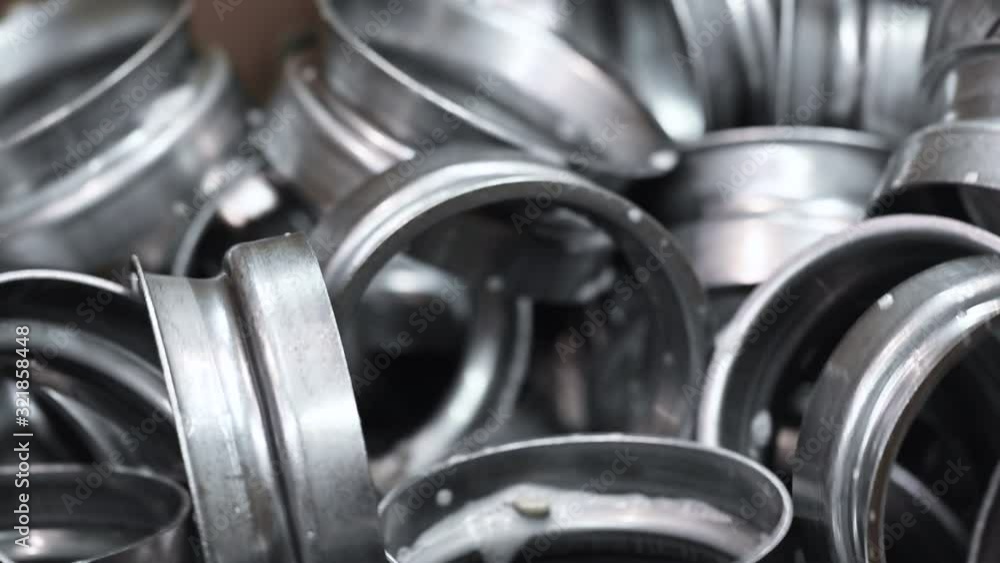 Finished metal pieces in conveyor belt of metal stamping industry. Industrial background . Finished metal pieces in conveyor belt of metal stamping industry. Industrial background .