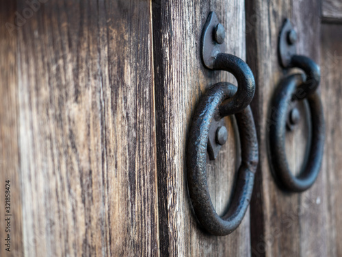 Obraz na plátně Wooden gate with rings