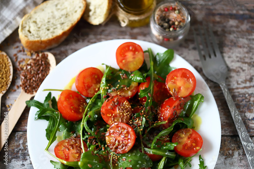 Healthy salad with tomatoes and arugula. Diet concept. Nutrition for weight loss.