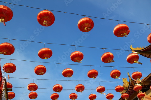 Lots of colorful Chinese lanterns against a sky background
