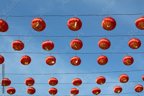 Lots of colorful Chinese lanterns against a sky background