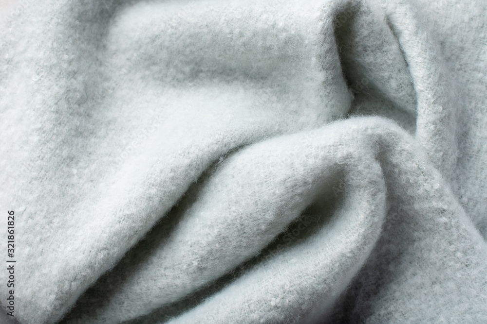 pastel blue soft background from plush fabric with folds on its surface. selective focus pastel blue soft background from plush fabric with folds on its surface. selective focus