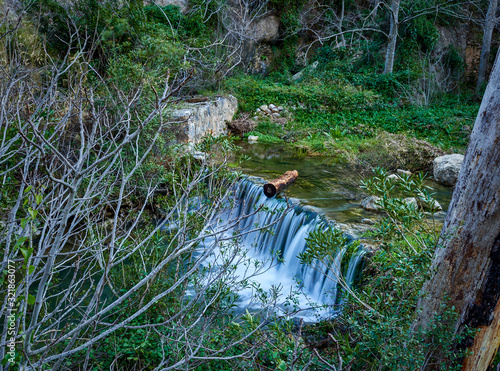 Small waterfall in the place of the “barranc dels tarongers” Onteniente, Spain photo