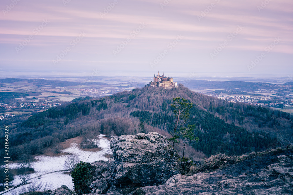 Elevated view of Hohenzollern Castle at sunrise, winter landscape, Baden Wuerttemberg, Germany