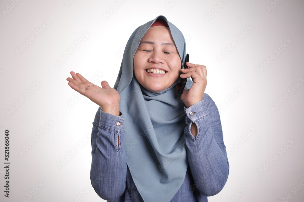 Muslim Lady Talking on Phone, Smiling Expression Muslim Lady Talking on Phone, Smiling Expression