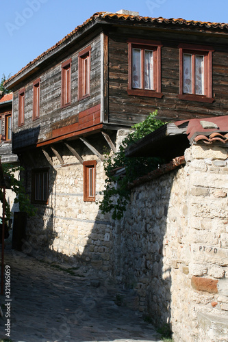  Old Town of Nesebar. Authentic wooden facade of a Bulgarian house. ground floor made of stone