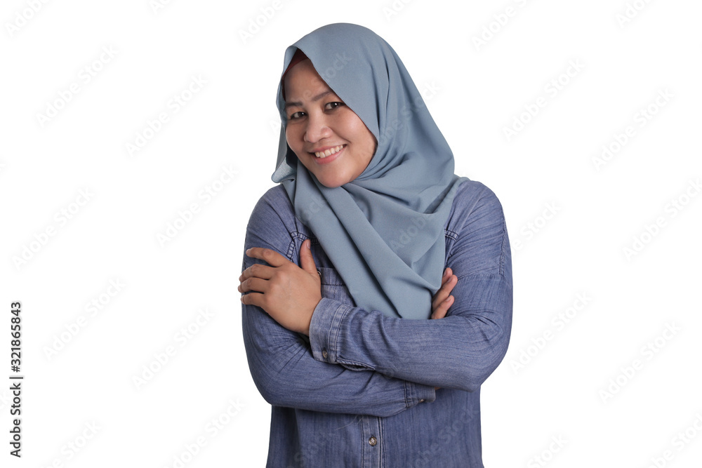 Confident Muslim Lady Smiling Friendly with Crossed Arms Confident Muslim Lady Smiling Friendly with Crossed Arms