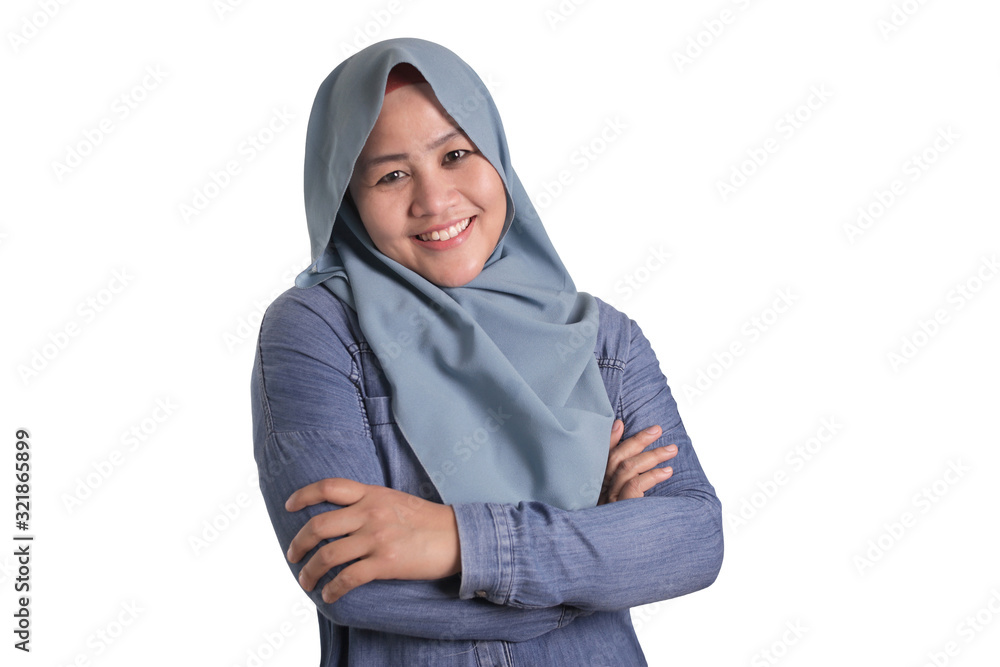 Confident Muslim Lady Smiling Friendly with Crossed Arms Confident Muslim Lady Smiling Friendly with Crossed Arms
