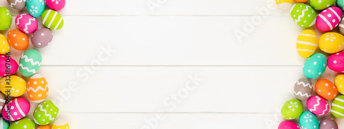 Canvas Print Colorful Easter banner with double Easter Egg side border against a white wood background