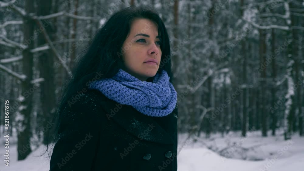 Sad Beautiful Girl Thinking Walking In Winter Forest During Snowfall. Vacation on Nature. Cold Frost Weather. Snow Covered Trees In Wood. Slow motion 60 fps Sad Beautiful Girl Thinking Walking In Winter Forest During Snowfall. Vacation on Nature. Cold Frost Weather. Snow Covered Trees In Wood. Slow motion 60 fps