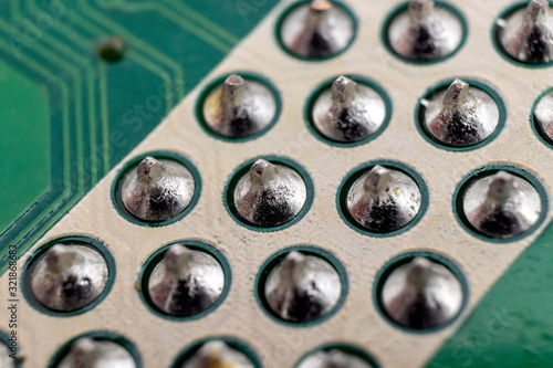 Soldered component pins on an LCD TV motherboard underside