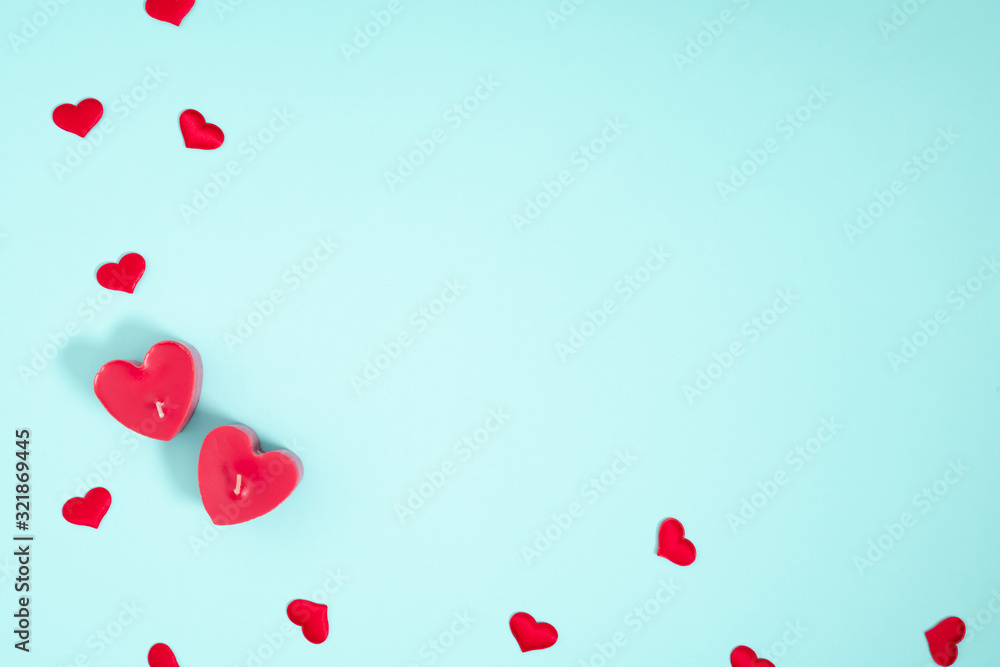 Valentine's Day background. Romantic composition with hearts on pastel blue background. Valentines Day heart. Flat lay, top view, copy space