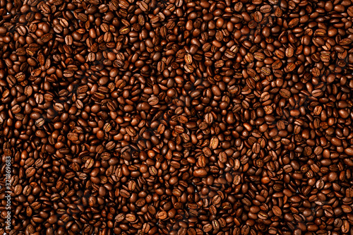 Coffee beans texture. Roasted coffee beans as background. Flat lay, top view, copy space