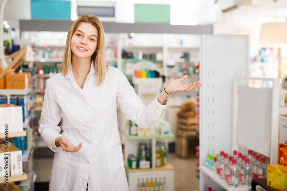 Female druggist working in pharmacy
