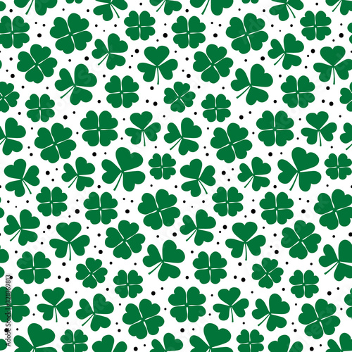 Clover leaves seamless pattern. Green Shamrock repetitive background. Happy St Patricks Day design. Cute simple print. Vector illustration.