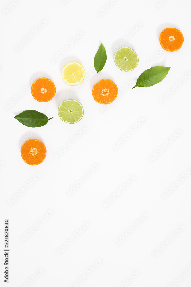 Citrus fruits pattern. Exotic fruits on white background. lemon, grapefruit, orange, lime, tangerine, fruit slices. Flat lay, top view, copy space Citrus fruits pattern. Exotic fruits on white background. lemon, grapefruit, orange, lime, tangerine, fruit slices. Flat lay, top view, copy space