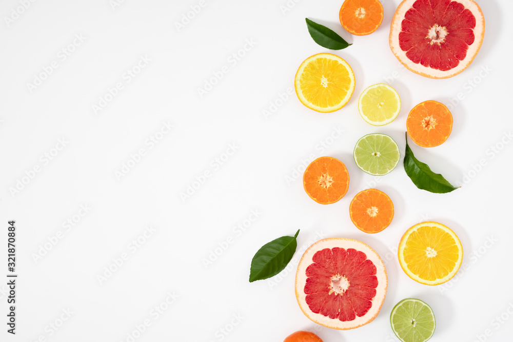 Citrus fruits pattern. Exotic fruits on white background. lemon, grapefruit, orange, lime, tangerine, fruit slices. Flat lay, top view, copy space Citrus fruits pattern. Exotic fruits on white background. lemon, grapefruit, orange, lime, tangerine, fruit slices. Flat lay, top view, copy space