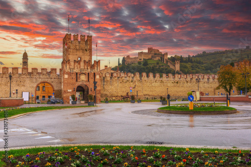 Medieval Castle of Soave in the province of Verona at sunset, Italy photo