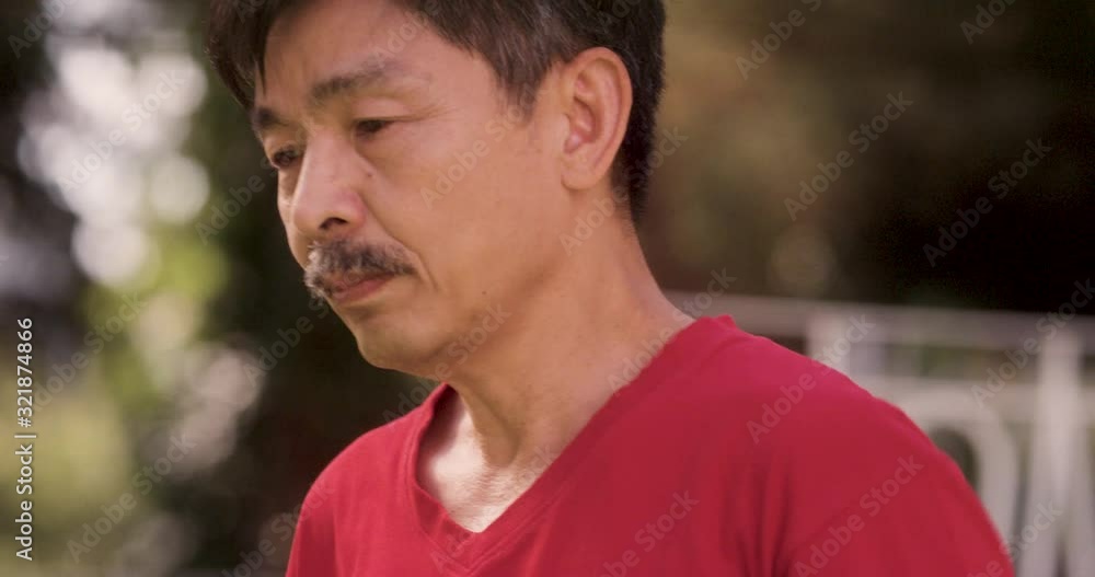 CU to LS Tilt & Swing Senior Man Exercising in Garden as Wife Tends to Flower Pots. Shot in R3D (6K RED RAW) CU to LS Tilt & Swing Senior Man Exercising in Garden as Wife Tends to Flower Pots. Shot in R3D (6K RED RAW)